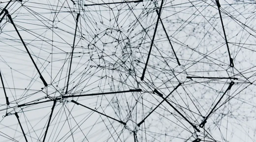 A network of nodes connected by lines. Photo by Alina Grubnya on Unsplash.